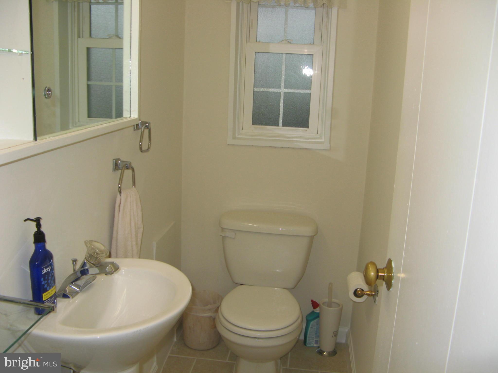 7302 Old Keene Mill Road Springfield, VA 22150 - Photo 27 of 28 a bathroom with a sink and a toilet