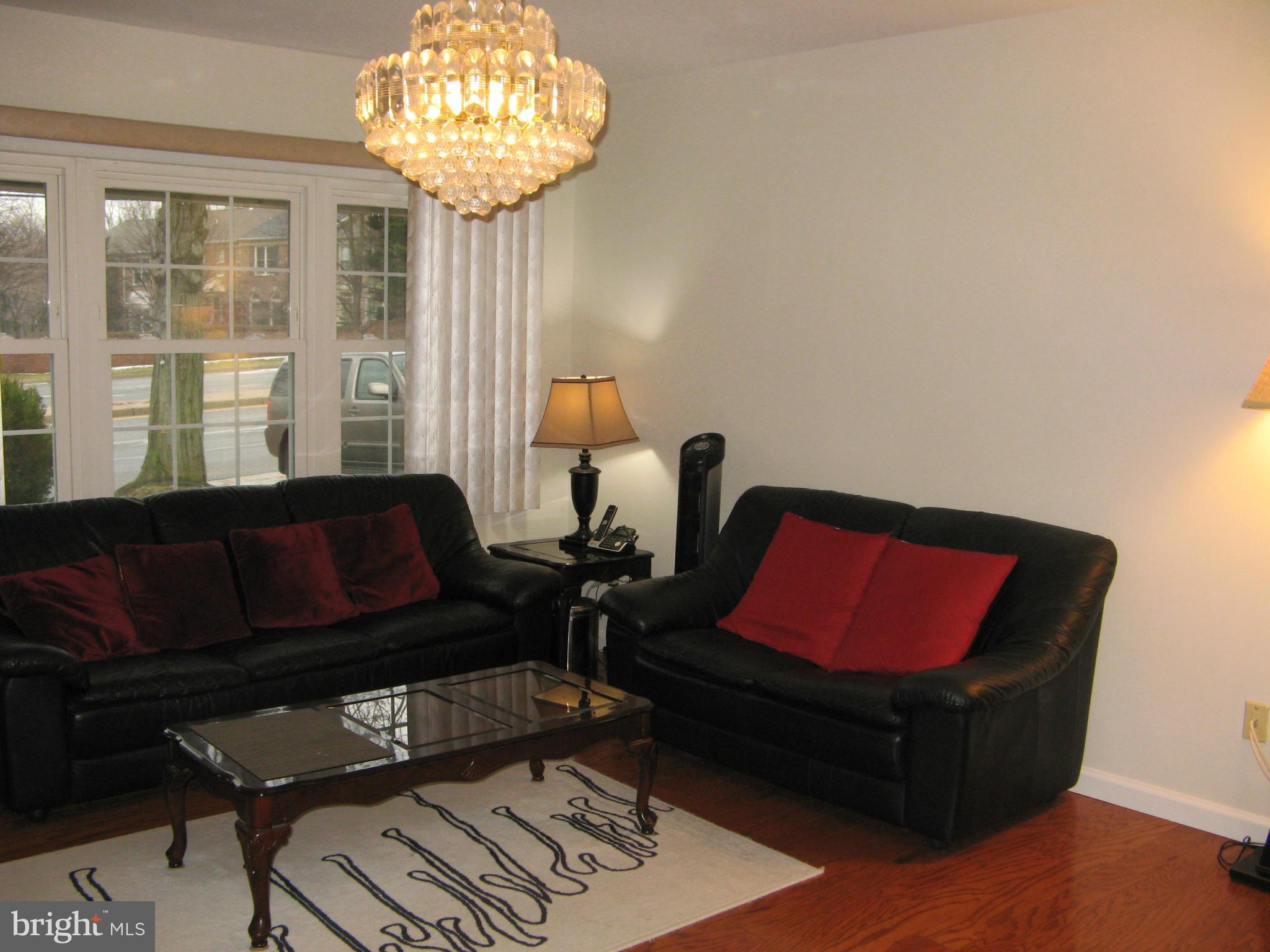 7302 Old Keene Mill Road Springfield, VA 22150 - Photo 7 of 28 a living room with furniture and a large window