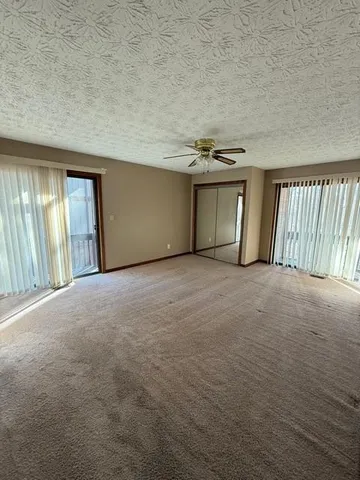 a spacious bathroom with a double vanity sink and mirror