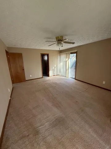 a bathroom with a sink mirror vanity and toilet