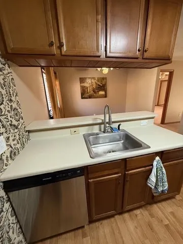 an empty room with windows and fireplace