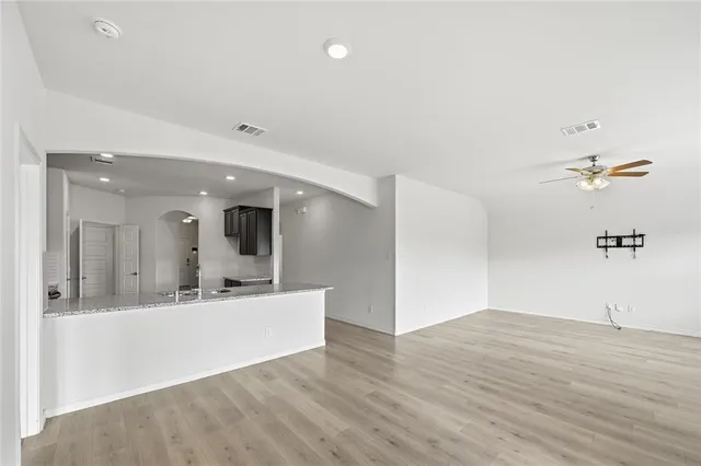 a view of a bathroom with sink and mirror