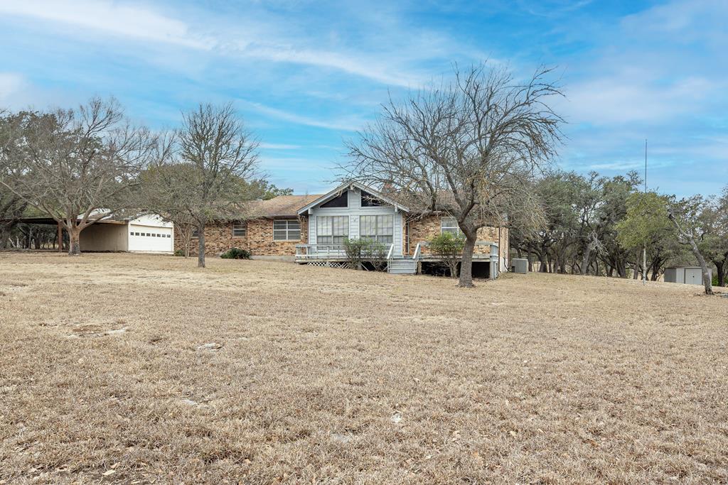 110 Sierra Road Kerrville, TX 78028 - Photo 1 of 31 a front view of a house with a yard covered with snow