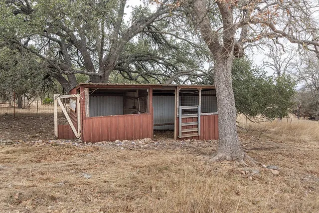 a view of house with backyard and bathroom