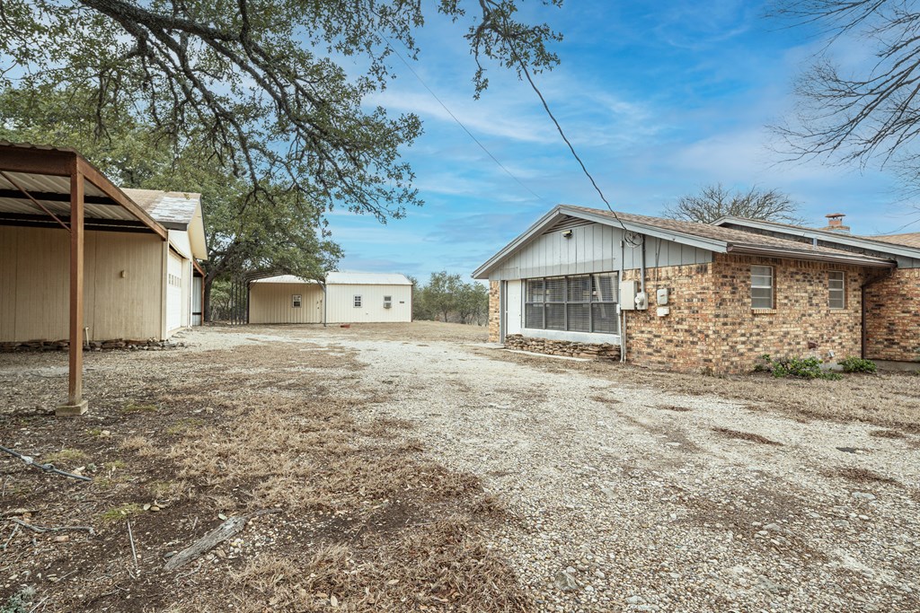 110 Sierra Road Kerrville, TX 78028 - Photo 29 of 31 a view of a house with a yard