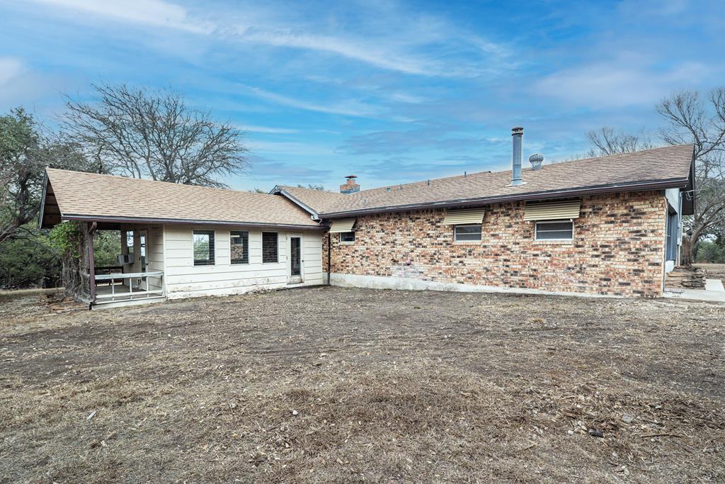 110 Sierra Road Kerrville, TX 78028 - Photo 30 of 31 a view of a house with a large tree and a yard