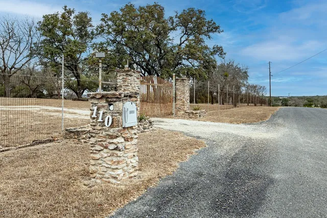 a view of a yard with a tree