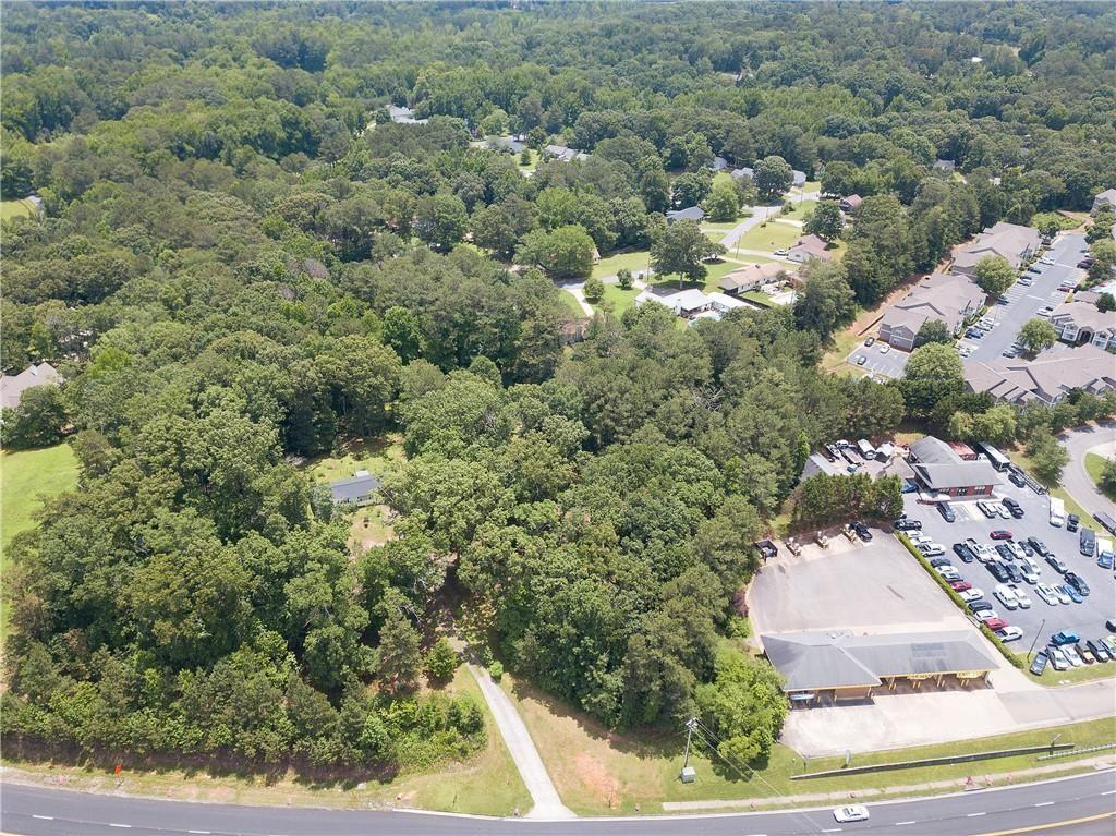 5700 Highway 20 Cartersville, GA 30121 - Photo 7 of 13 an aerial view of a house with a yard and large trees