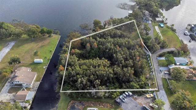 an aerial view of house with yard