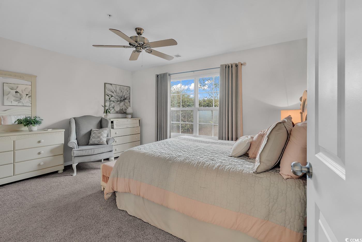 117 Butkus Drive, Unit 2 Myrtle Beach, SC 29588 - Photo 18 of 39 Carpeted bedroom with ceiling fan