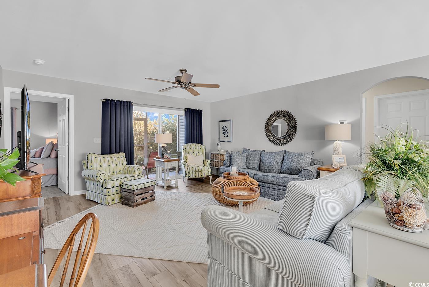 117 Butkus Drive, Unit 2 Myrtle Beach, SC 29588 - Photo 2 of 39 Living area featuring wood finished floors and a ceiling fan