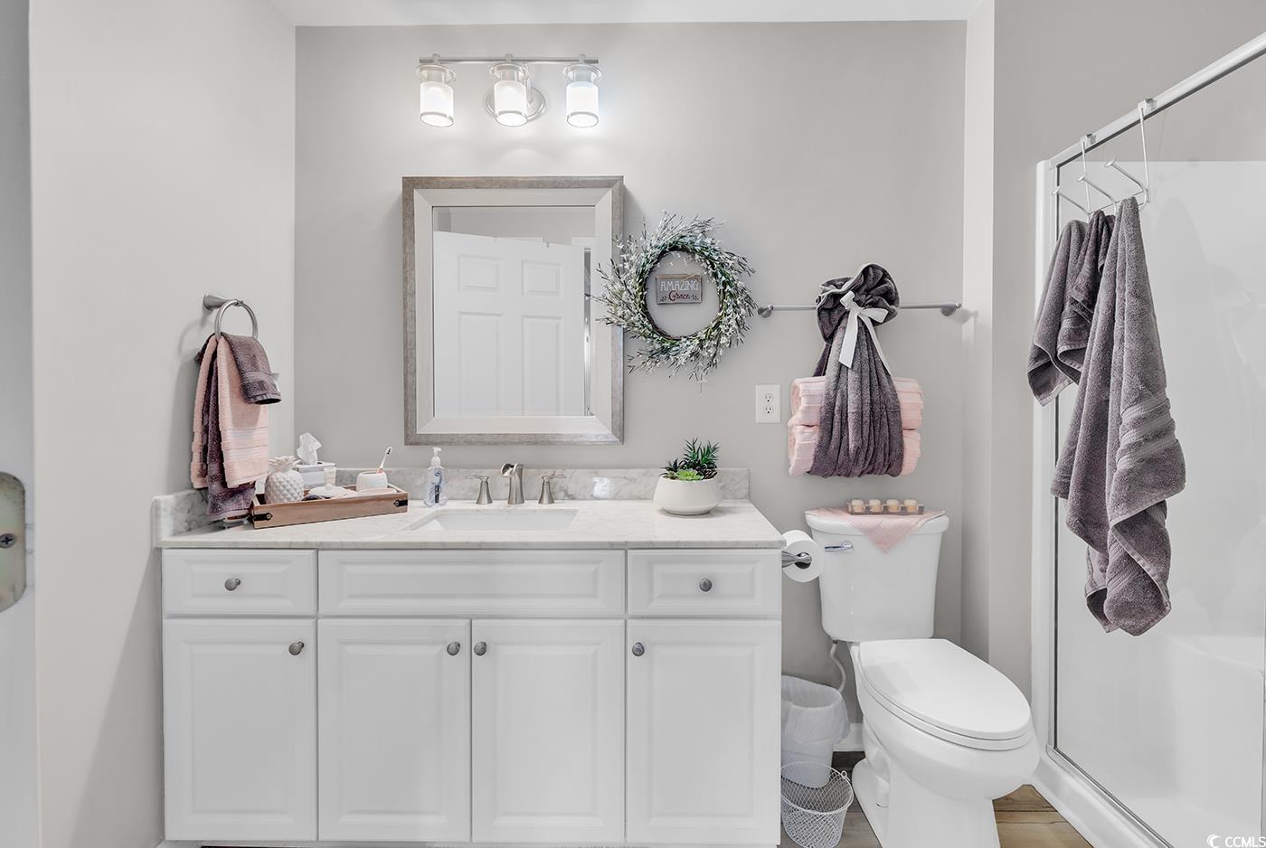 117 Butkus Drive, Unit 2 Myrtle Beach, SC 29588 - Photo 21 of 39 Full bathroom featuring vanity and a stall shower
