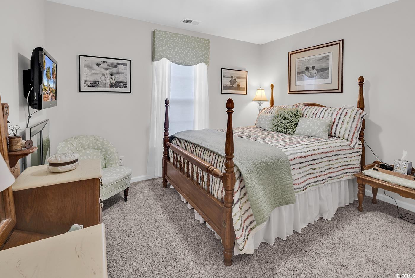 117 Butkus Drive, Unit 2 Myrtle Beach, SC 29588 - Photo 23 of 39 Bedroom with light colored carpet and baseboards
