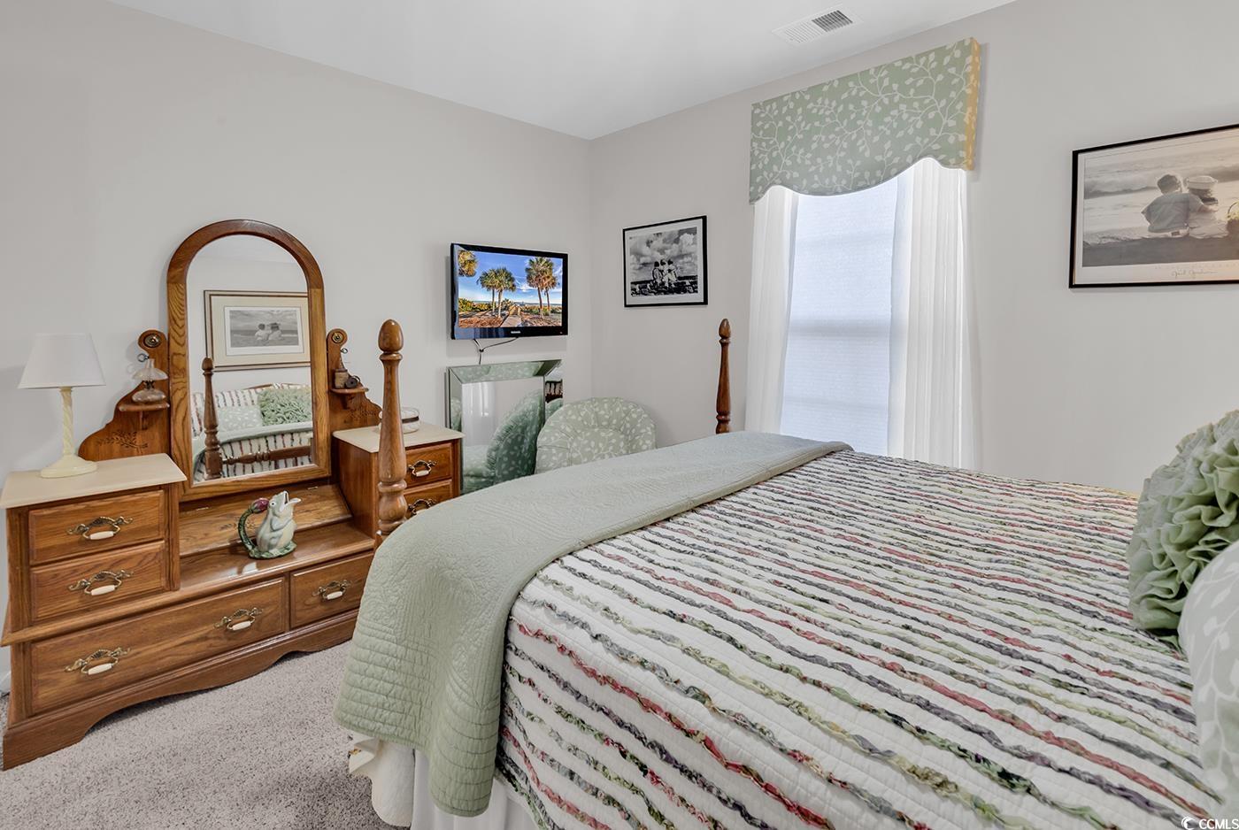 117 Butkus Drive, Unit 2 Myrtle Beach, SC 29588 - Photo 25 of 39 Bedroom featuring light colored carpet
