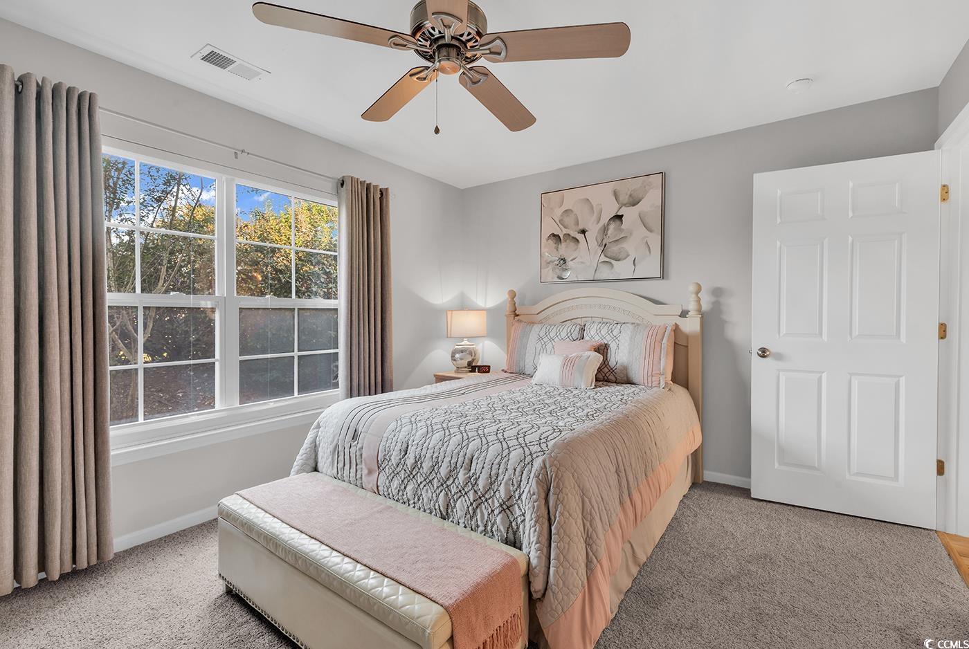 117 Butkus Drive, Unit 2 Myrtle Beach, SC 29588 - Photo 4 of 39 Bedroom featuring carpet and a ceiling fan