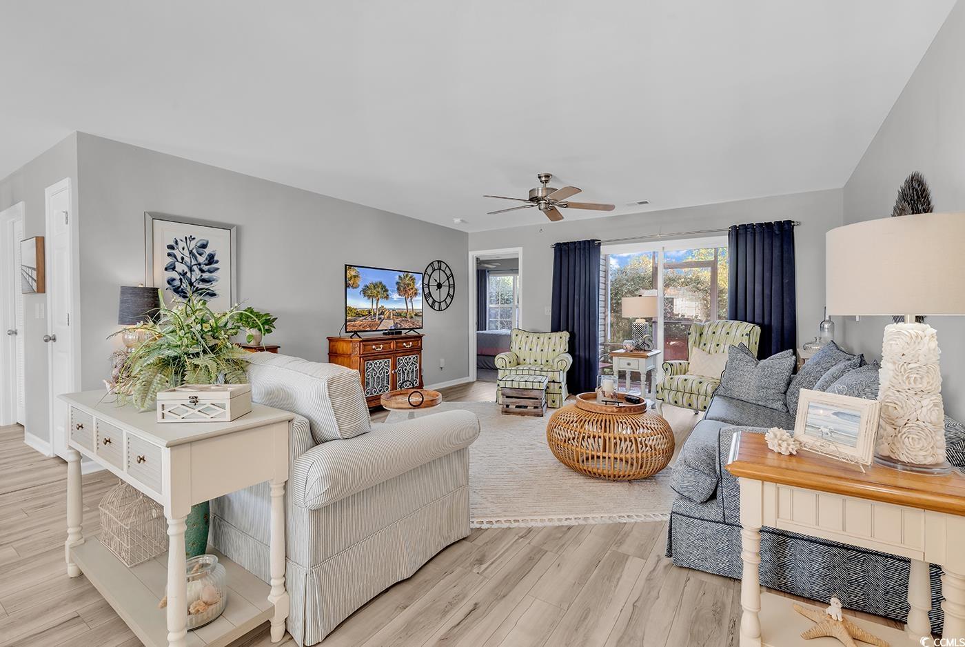117 Butkus Drive, Unit 2 Myrtle Beach, SC 29588 - Photo 9 of 39 Living room featuring light wood finished floors and a ceiling fan