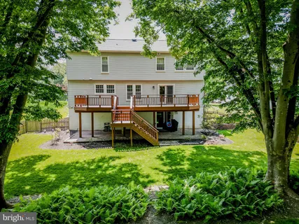 a view of a house with a back yard