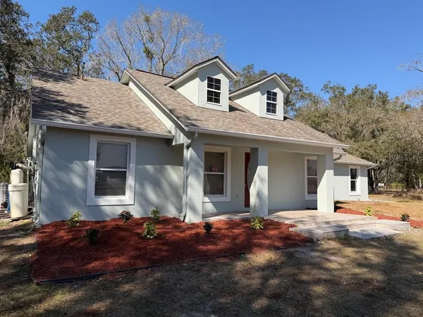 a front view of house with a yard