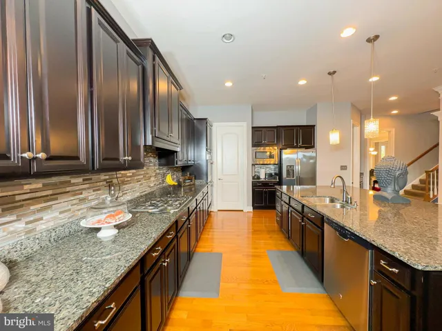 a view of a dining room with furniture and a potted plant