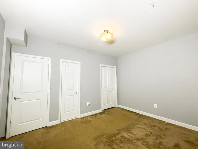 a view of living room filled with furniture and a fireplace