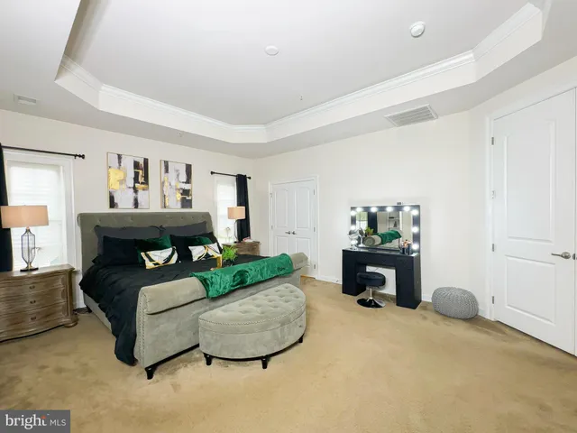 a living room with a flat screen tv and a large window