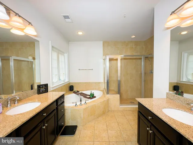 a spacious bedroom with a bed and a couch