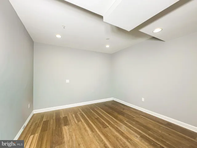 a aerial view of a house with a yard table and chairs