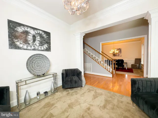 a kitchen with a table chairs sink and cabinets