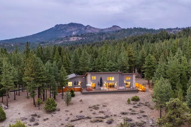a view of a town with mountains in the background