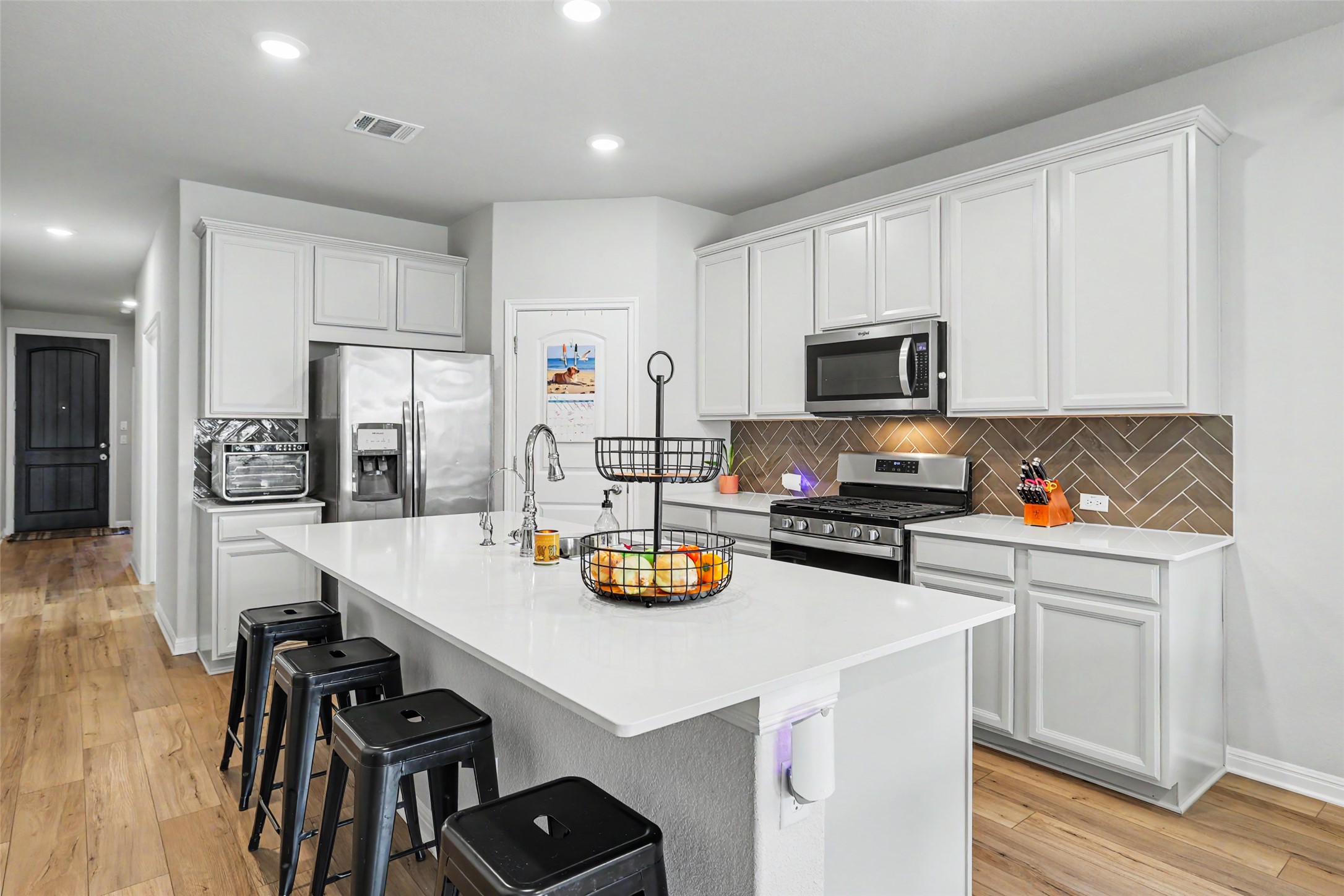 112 Rocking R Court Georgetown, TX 78633 - Photo 8 of 40 A well-appointed kitchen features a large central island and stainless steel appliances, creating an inviting space.