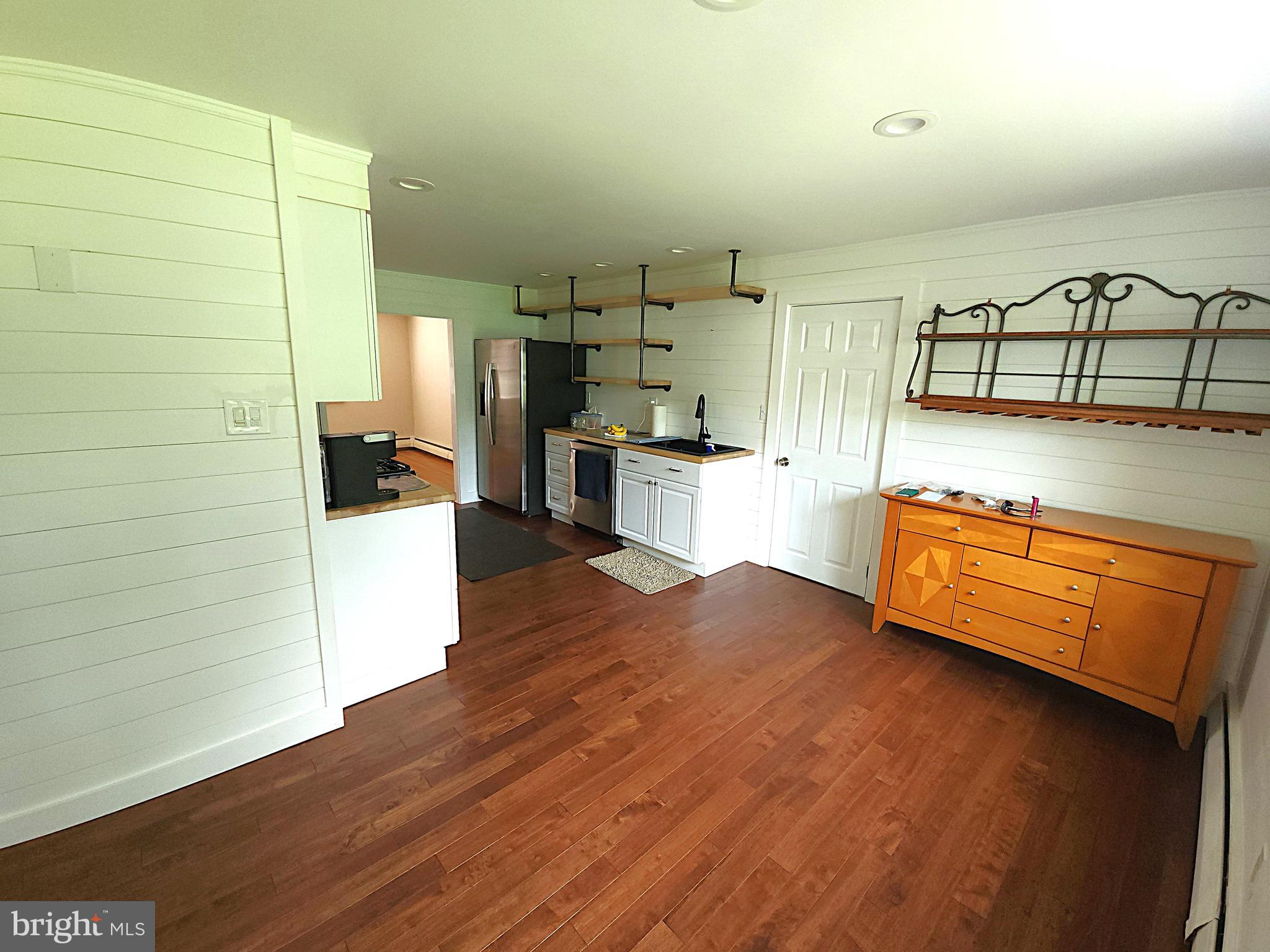 2613 Caranel Road Broomall, PA 19008 - Photo 11 of 49 a kitchen with stainless steel appliances wooden floors and a counter top space