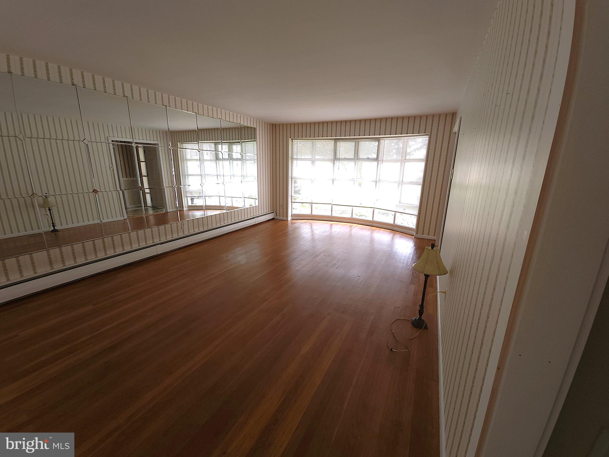 2613 Caranel Road Broomall, PA 19008 - Photo 18 of 49 a view of empty room with wooden floor and fan