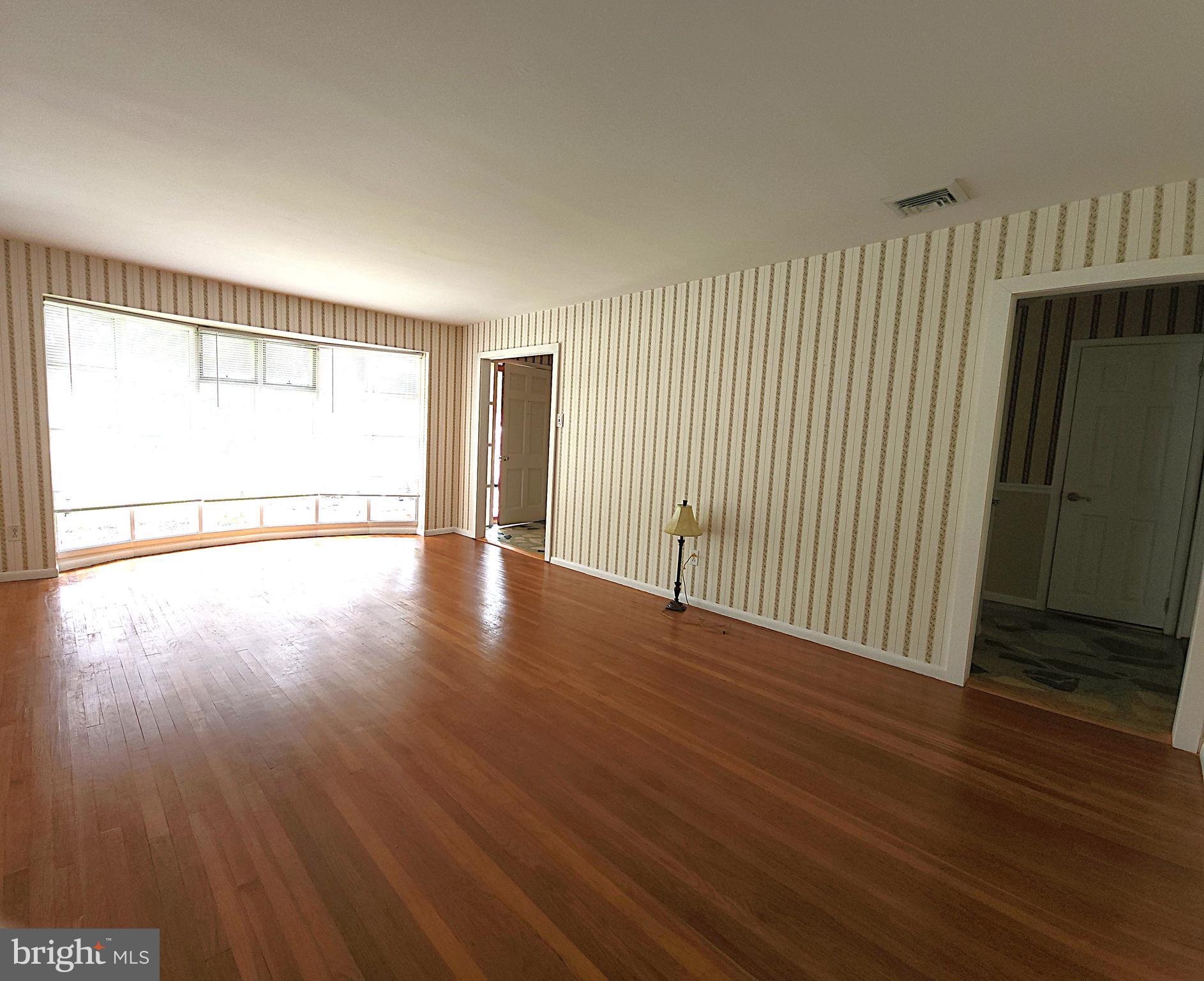 2613 Caranel Road Broomall, PA 19008 - Photo 19 of 49 an empty room with wooden floor and windows