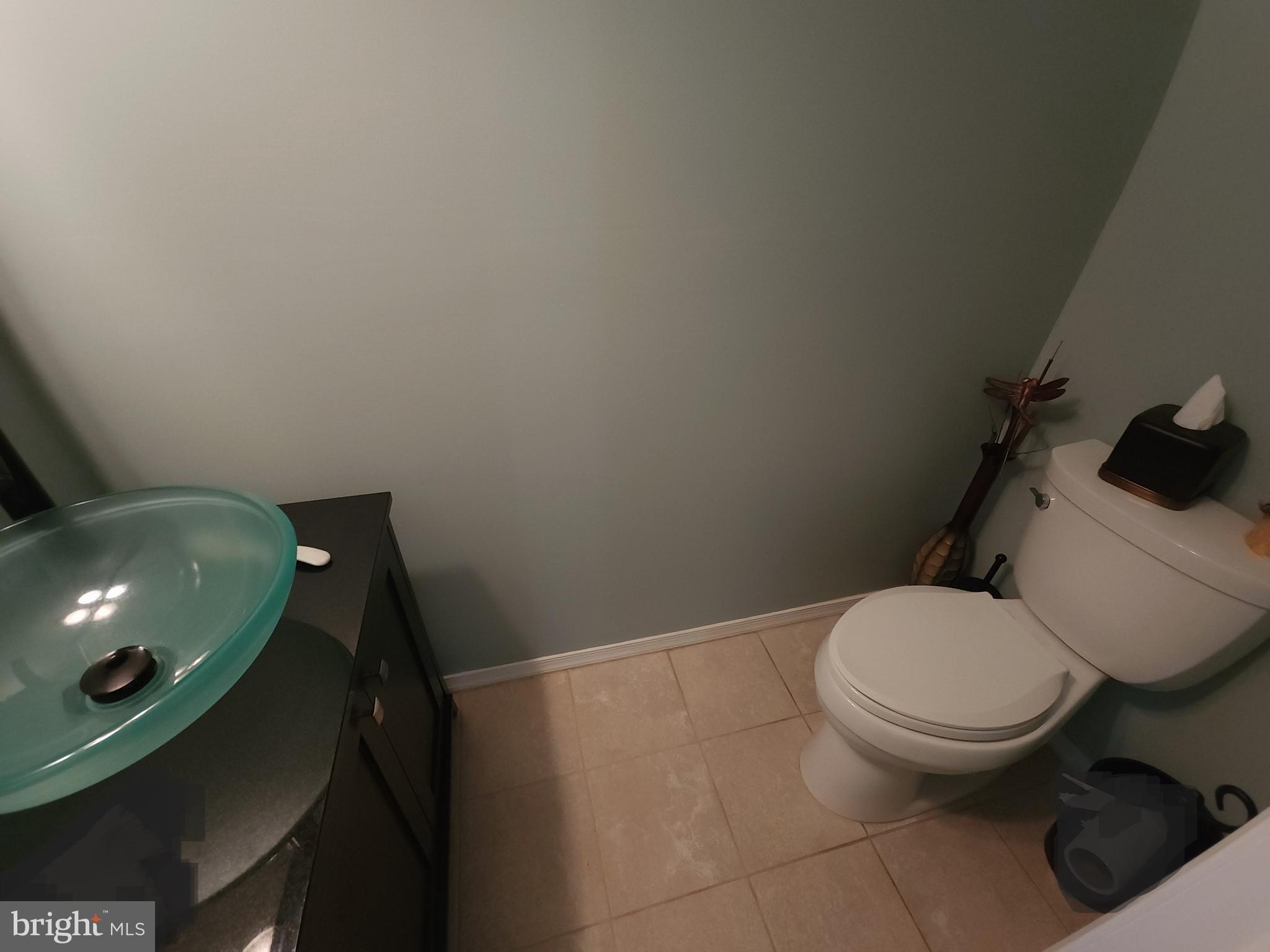 2613 Caranel Road Broomall, PA 19008 - Photo 20 of 49 a white toilet sitting next to a bathroom sink and vanity