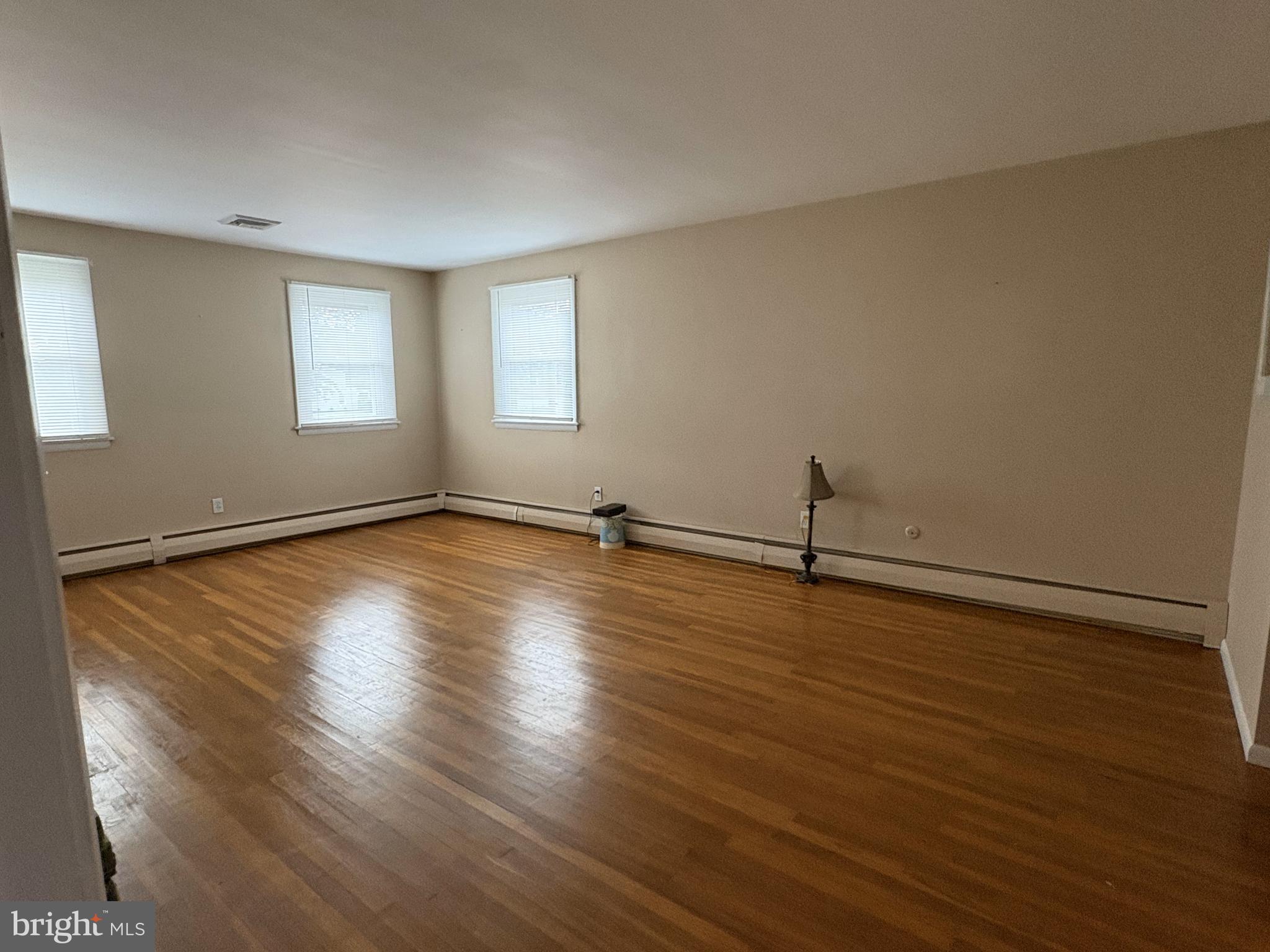 2613 Caranel Road Broomall, PA 19008 - Photo 22 of 49 a view of a room with wooden floor and window