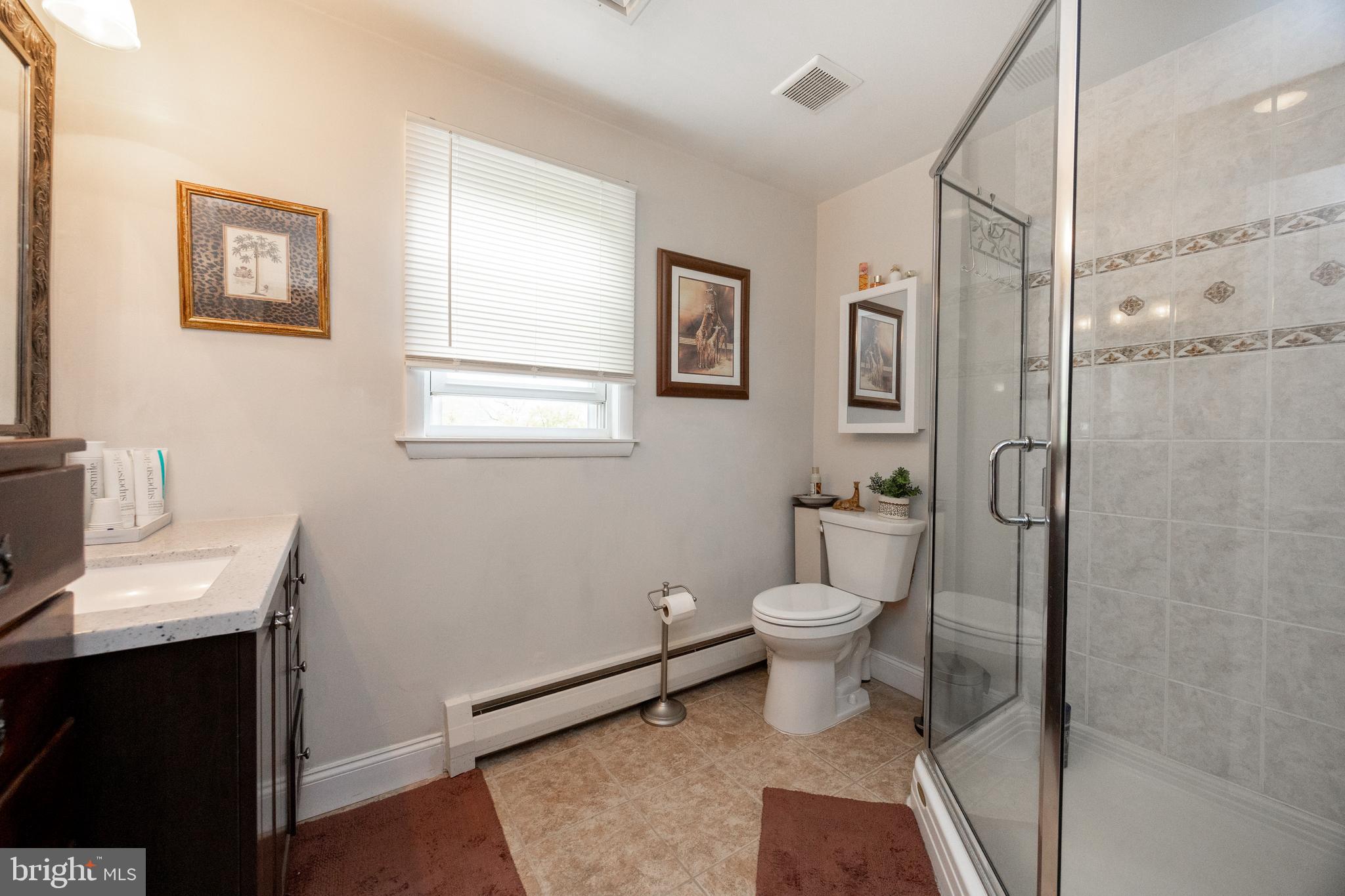 2613 Caranel Road Broomall, PA 19008 - Photo 24 of 49 a bathroom with a toilet a sink and shower