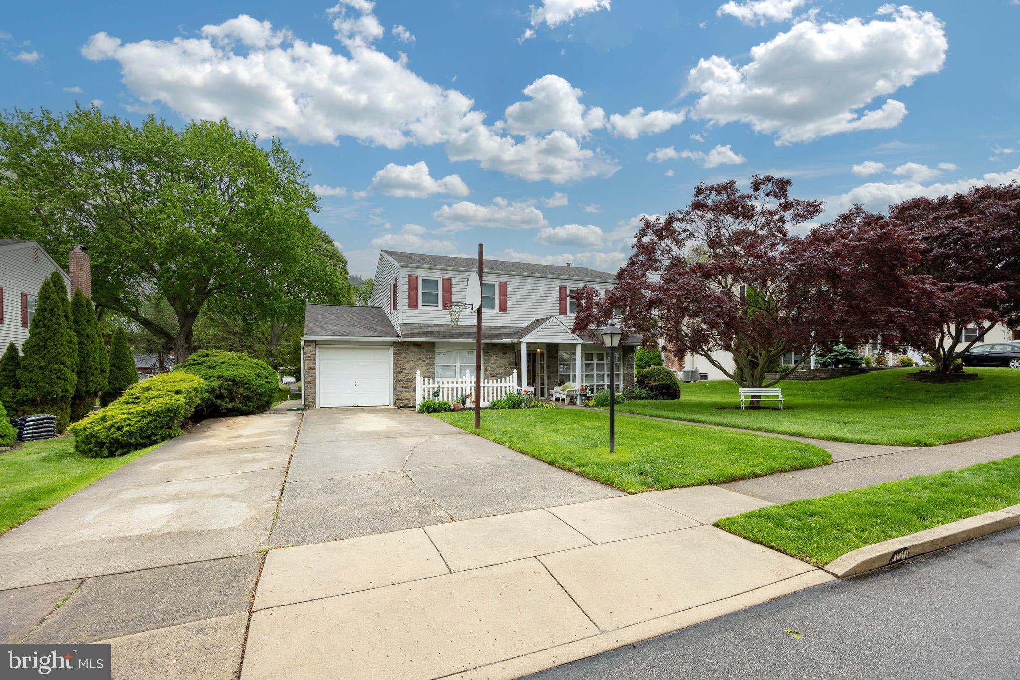 2613 Caranel Road Broomall, PA 19008 - Photo 33 of 49 a view of a house with a big yard and a large tree