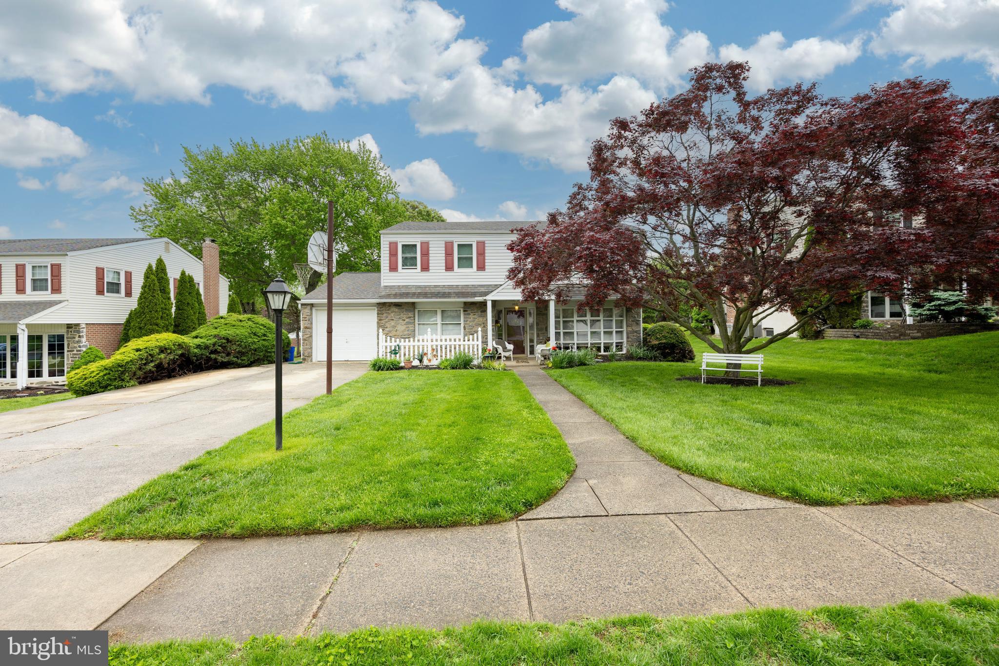 2613 Caranel Road Broomall, PA 19008 - Photo 37 of 49 a sign that is sitting in front of a house with a garden