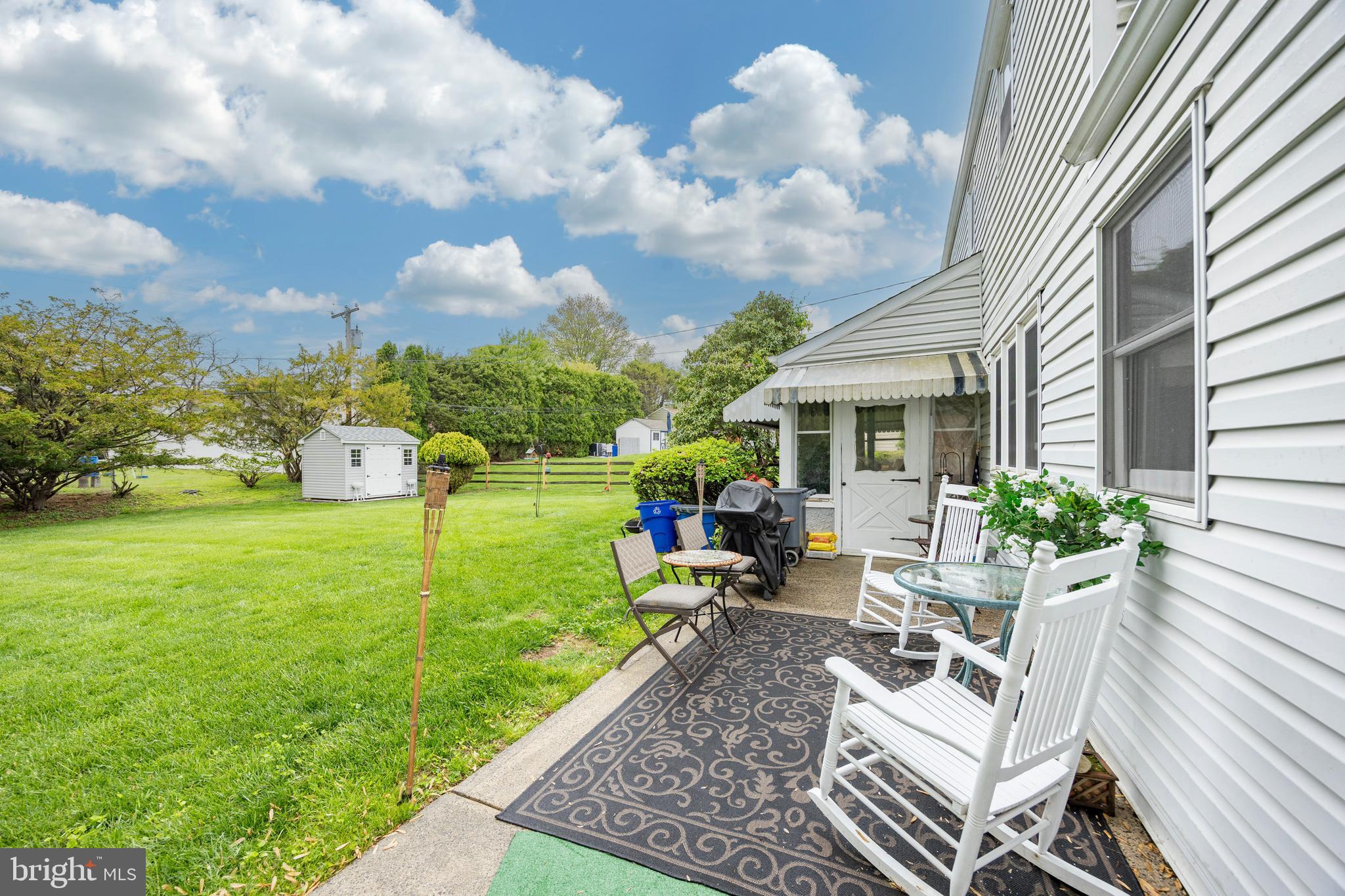 2613 Caranel Road Broomall, PA 19008 - Photo 46 of 49 a view of a house with backyard sitting area and garden