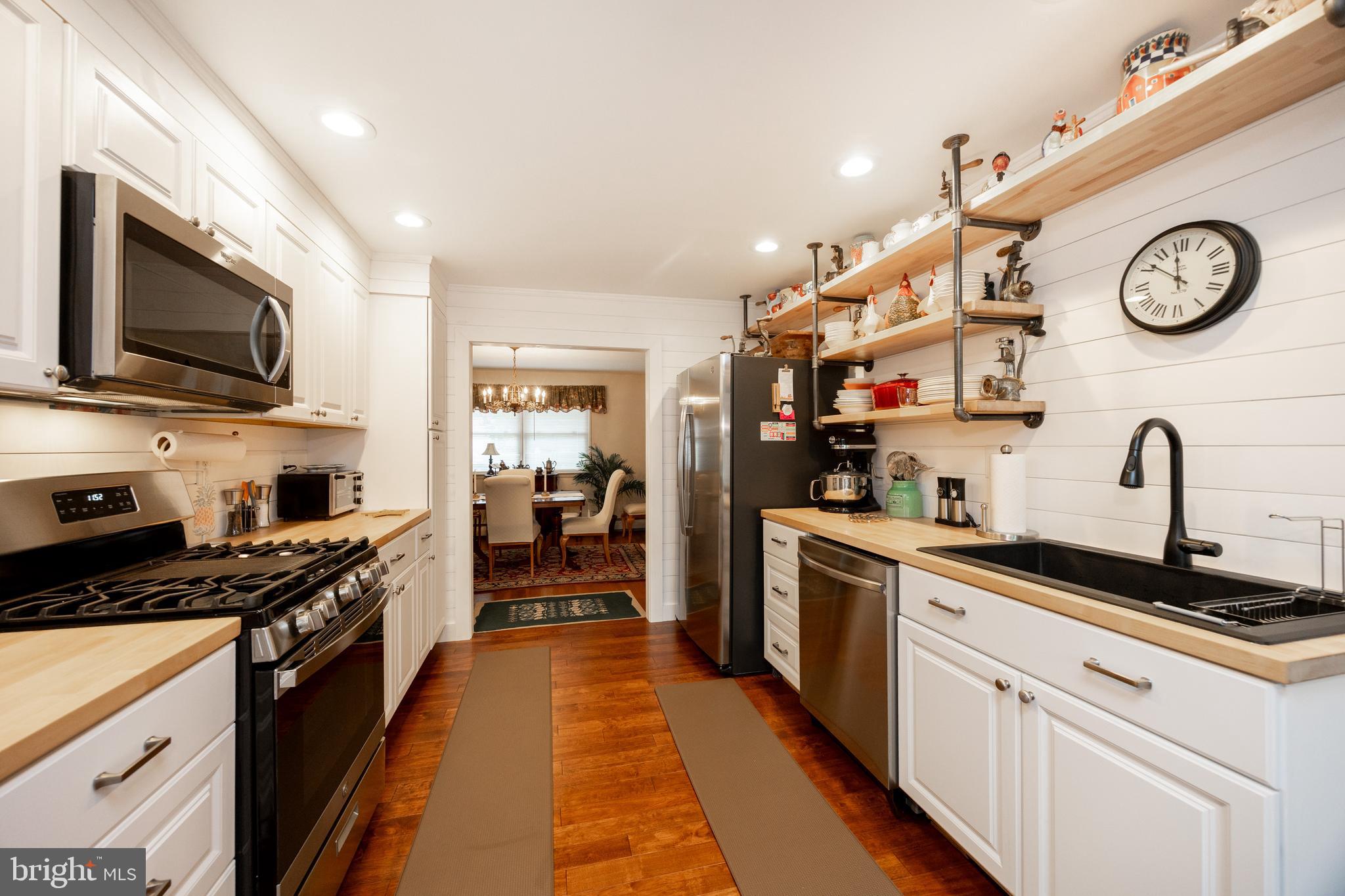 2613 Caranel Road Broomall, PA 19008 - Photo 8 of 49 a kitchen with stainless steel appliances granite countertop a sink and cabinets