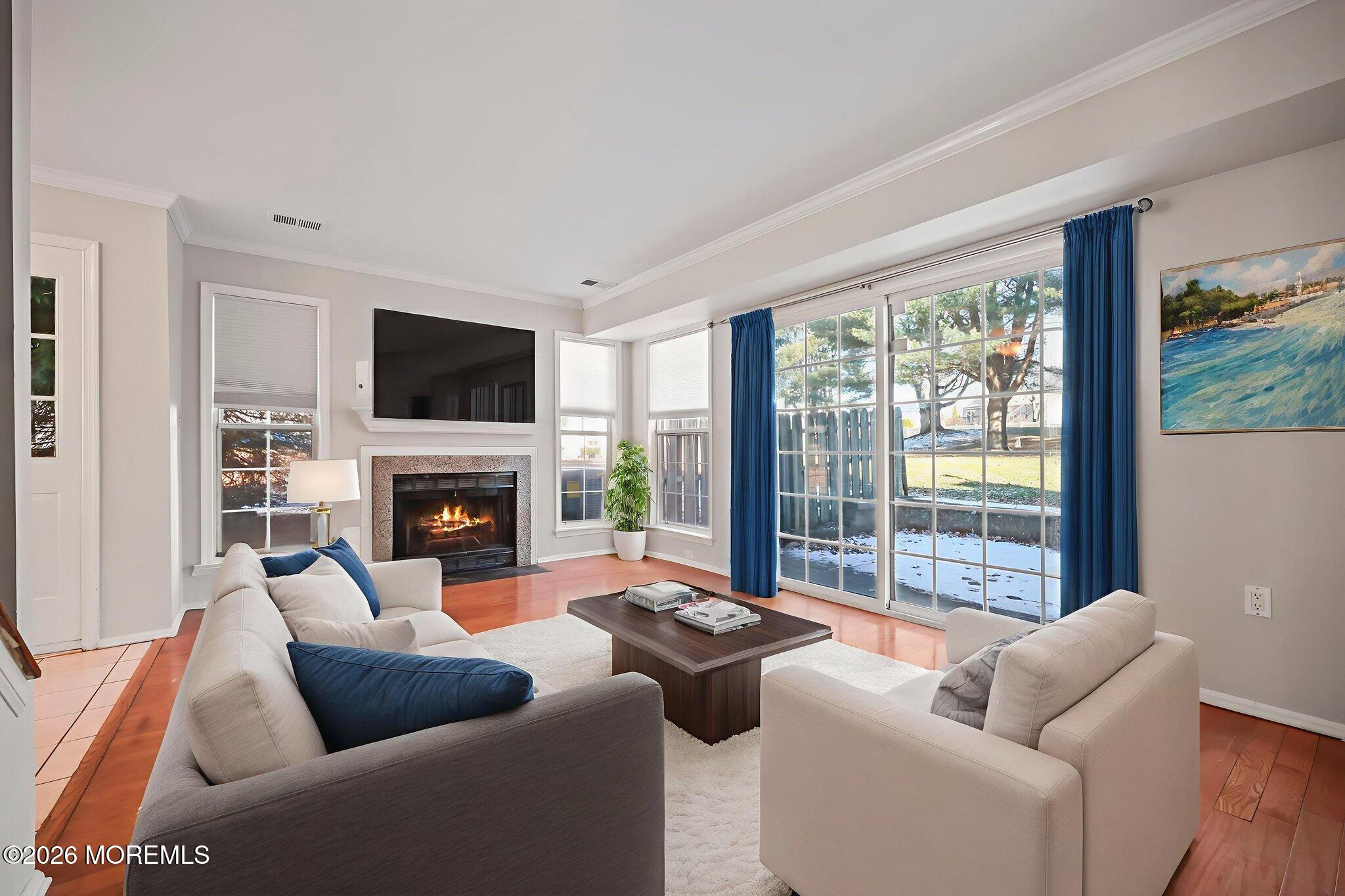 12 Duncan Way Freehold, NJ 07728 - Photo 12 of 30 a living room with furniture a fireplace and a large window
