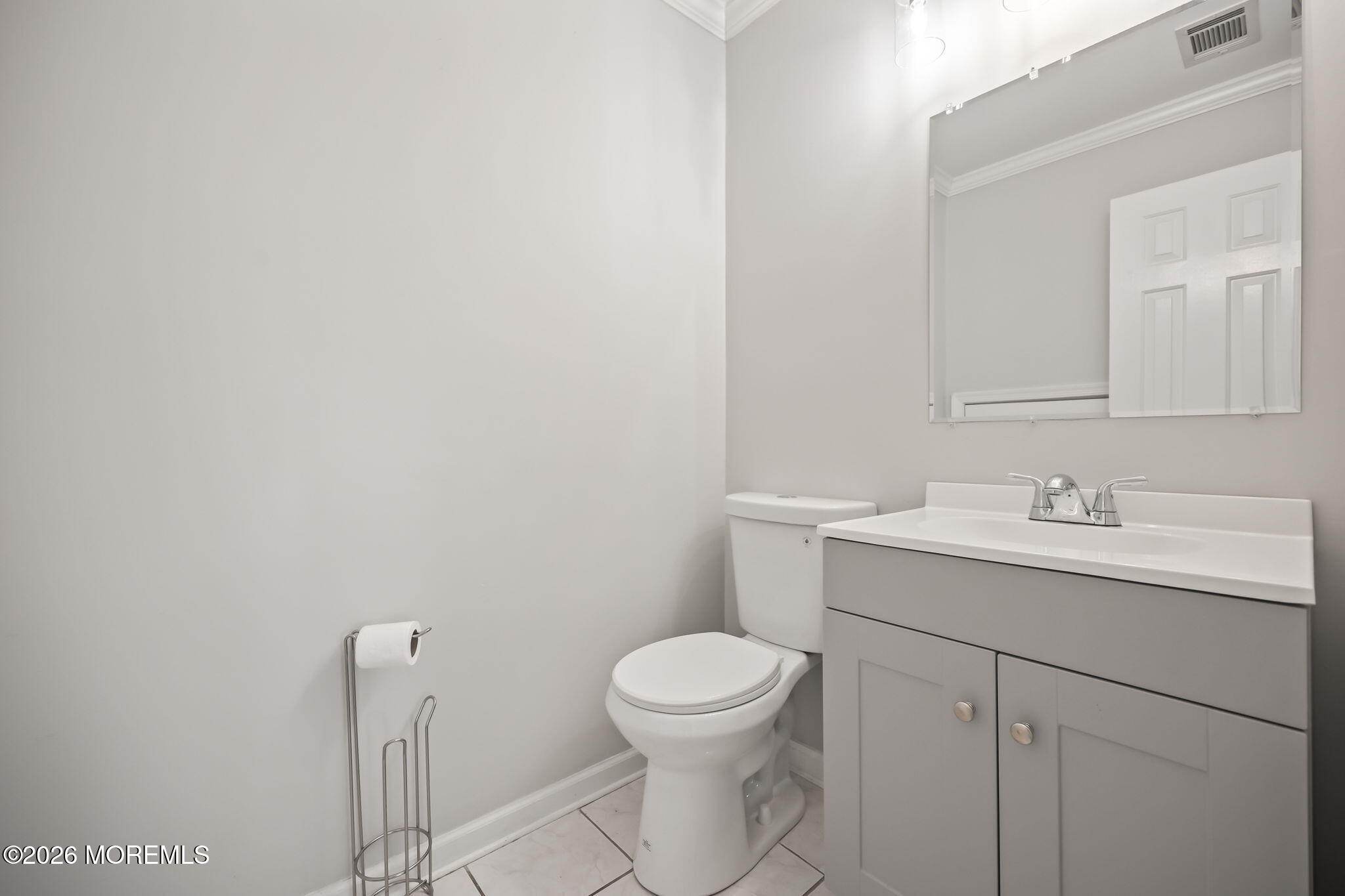 12 Duncan Way Freehold, NJ 07728 - Photo 15 of 30 a bathroom with a toilet a sink and mirror