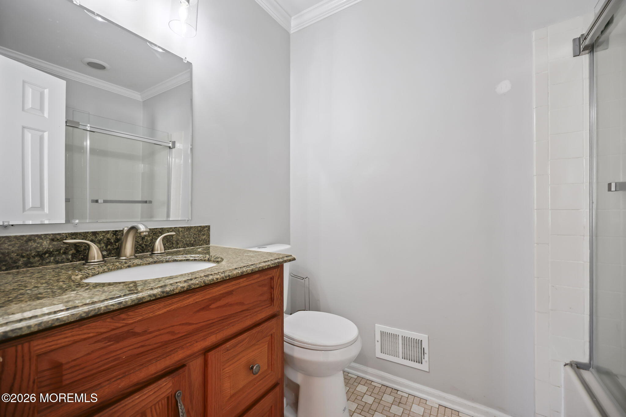 12 Duncan Way Freehold, NJ 07728 - Photo 21 of 30 a bathroom with a granite countertop toilet sink and mirror