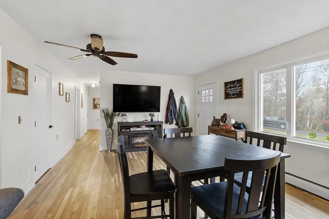 a view of a dining room with furniture window and wooden floor
