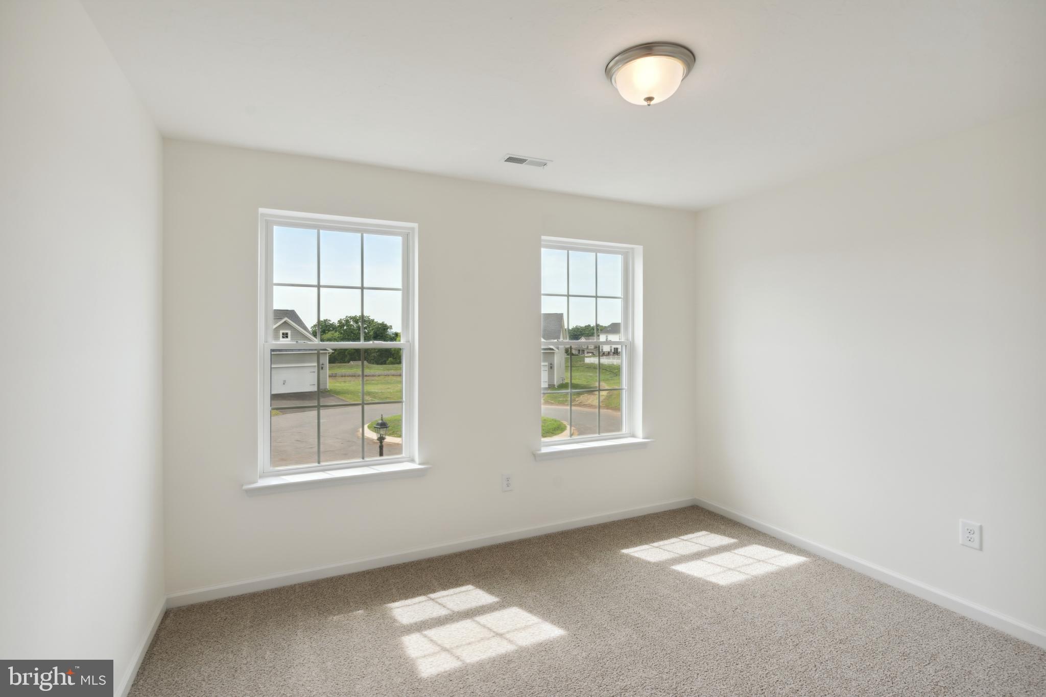 168 Ledger Drive, Unit 74 Hanover, PA 17331 - Photo 20 of 28 an empty room with windows