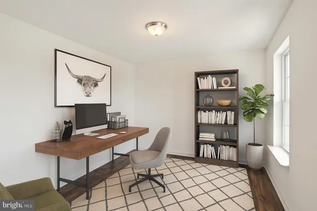 a workspace with furniture and window