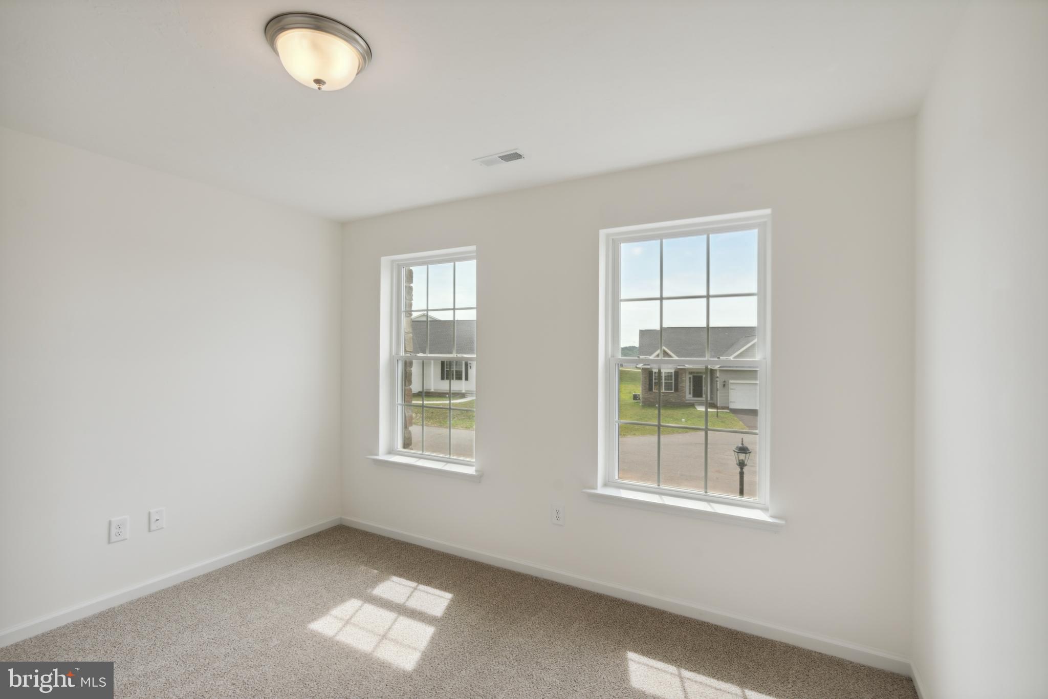168 Ledger Drive, Unit 74 Hanover, PA 17331 - Photo 21 of 28 an empty room with windows