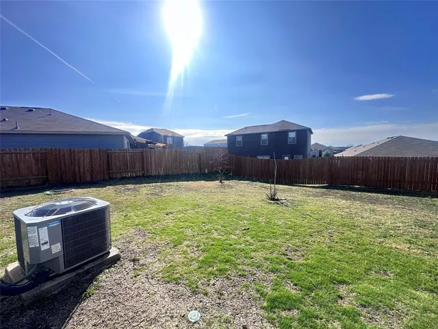 a view of a backyard with a tub