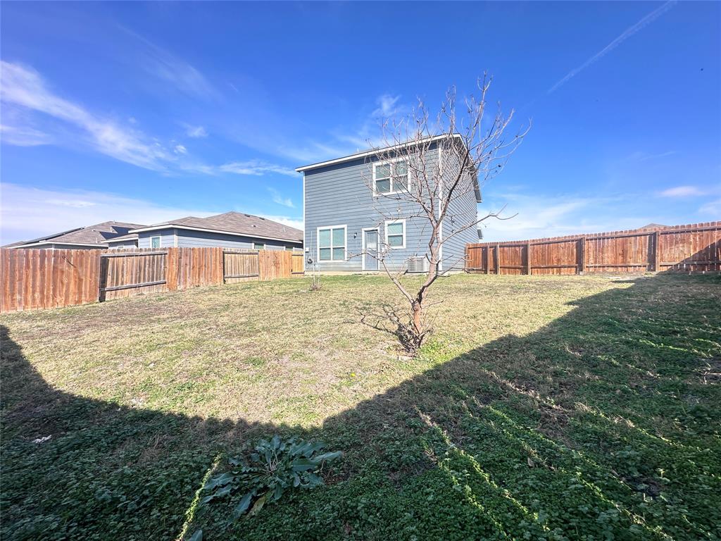 14310 Wrangler Way Dallas, TX 75253 - Photo 26 of 29 a large building with a yard