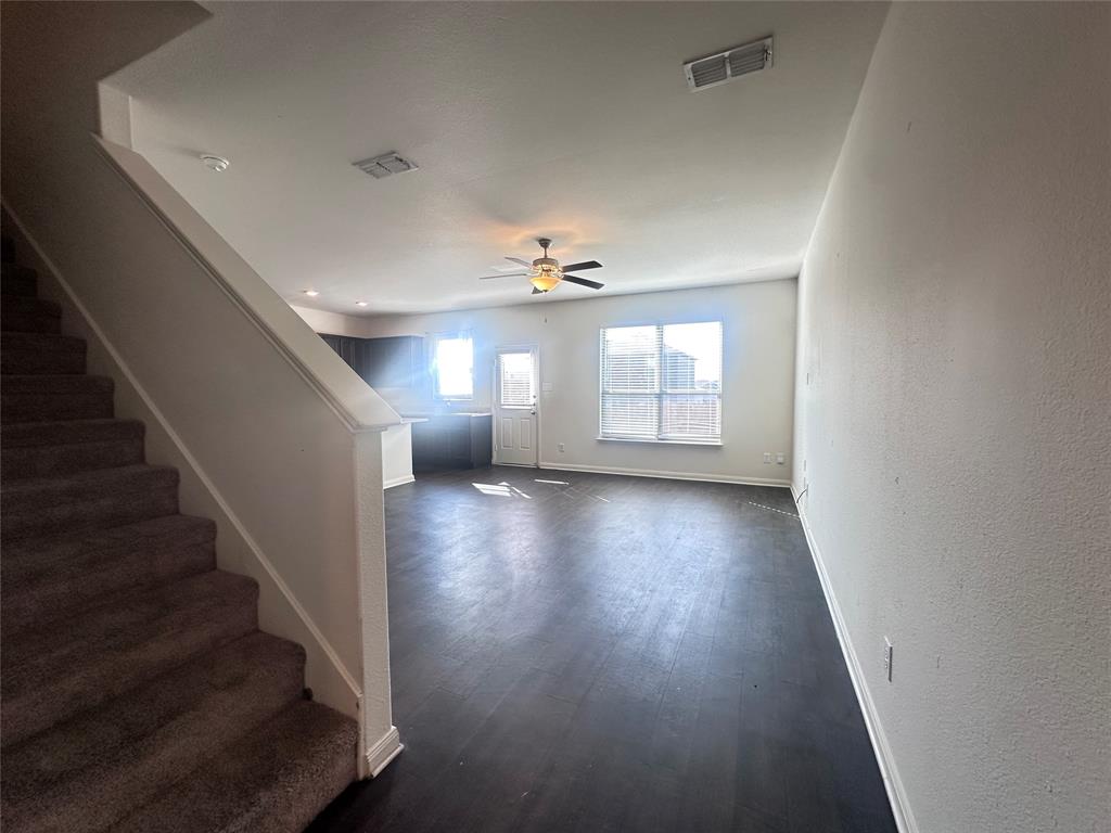 14310 Wrangler Way Dallas, TX 75253 - Photo 4 of 29 wooden floor in an empty room with a window